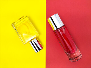 glass perfume bottles on a two-toned paper background