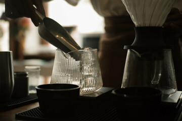 a brewer is brewing Japanese filter coffee
