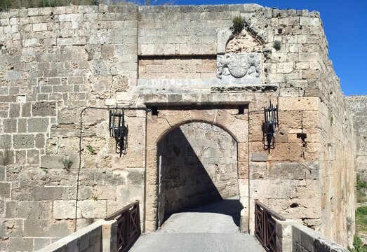 Photo of Saint Athanasios Gate in Rhodes island, Greece, a historic arched stone gate within fortification walls, built between 1441 and 1442. 