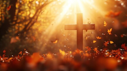 Christian cross with sunlight streaming through fall autumn leaves, creating a peaceful and serene background