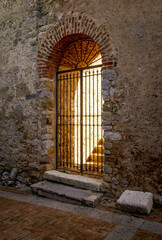 Ancient doorway lit up with golden light