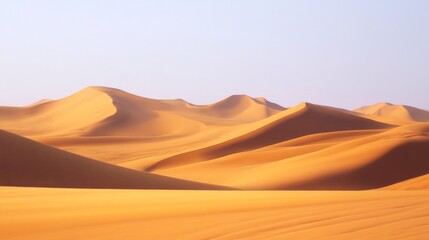 Golden Sand Dunes Under a Clear Daytime Sky