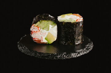 traditional Japanese sushi on a black background
