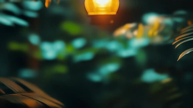 Beautiful moth illuminated by warm light at night in a tranquil garden setting