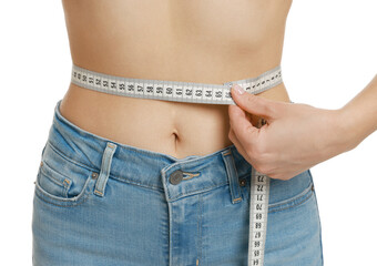 Woman measuring waist circumference on white background, closeup