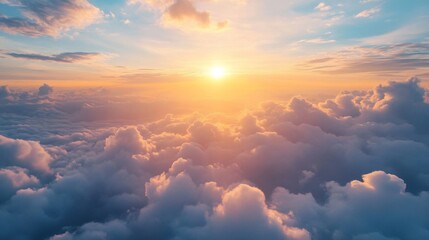 Aerial View of Sunset Above Fluffy Clouds