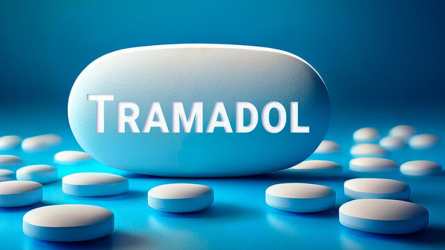 Tramadol pill with the name printed on it, blue background	