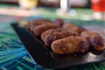crispy and soft codfish fritters, fried Portuguese dish