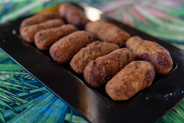 crispy and soft codfish fritters, fried Portuguese dish