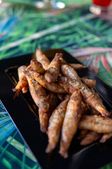 portion of small manjuba delicious breaded and fried dish