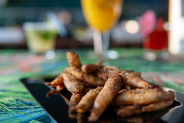 portion of small manjuba delicious breaded and fried dish
