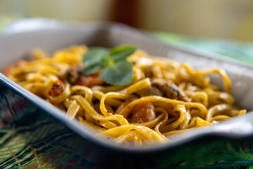Perfect tagliatelle with shrimp and a green detail