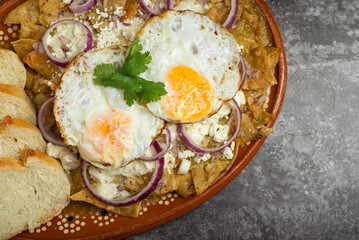 Delicious Mexican Chilaquiles with Eggs and Bread.