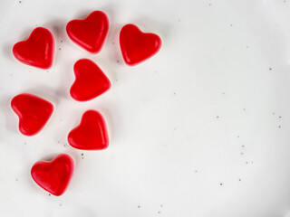 Red Heart Candy Pieces on White Background for Valentine's Day Decor