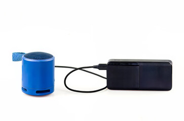 Blue Portable Speaker and Black Power Bank on White Background