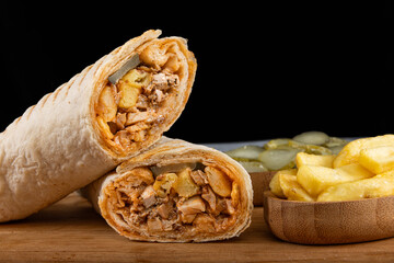 Lavash chicken doner. Pita bread lavash roll chicken doner kebab and fresh vegetables. Durum...