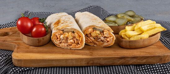 Lavash chicken doner. Pita bread lavash roll chicken doner kebab and fresh vegetables. Durum Chicken Doner Kebab.