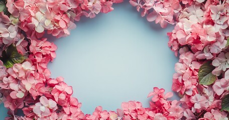 A design concept featuring a rectangular white placeholder, accentuated by an arrangement of soft pink spring flowers