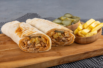 Lavash chicken doner. Pita bread lavash roll chicken doner kebab and fresh vegetables. Durum...