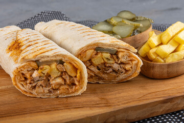 Lavash chicken doner. Pita bread lavash roll chicken doner kebab and fresh vegetables. Durum...