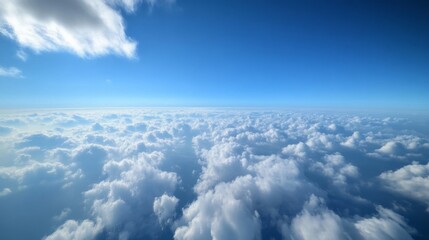 Naklejka premium Aerial View of Fluffy White Clouds Over Blue Sky