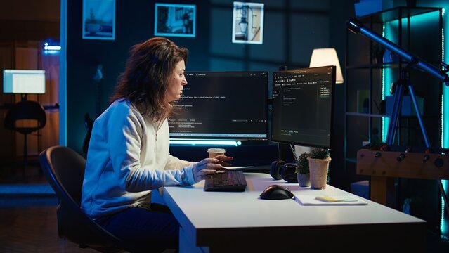 Tired woman hurting from too much stress accumulated while doing software quality assurance on computer. Developer suffers from headache after inspecting coding on PC for too long, camera B