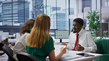 Businessman attending job interview with the HR employees in office, discussing about career plans...
