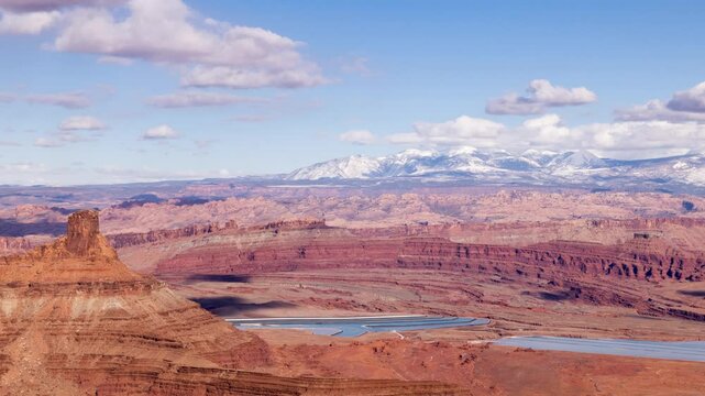 Time Lapse of the clouds moving above the rugged landscape near Canyonlands National Park in Moab Utah.