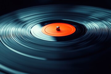 Close Up of Spinning Vinyl Record with Orange Label in Chiaroscuro Lighting