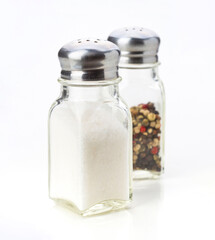 Salt and pepper shakers in simple design on white background for dining table setting