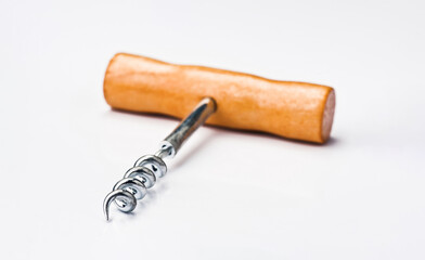 Corkscrew with wooden handle on a white background showcasing a wine opening tool