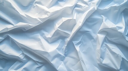 Obraz premium A close-up view of a pristine white sheet draped elegantly against a vibrant blue background, showcasing texture.