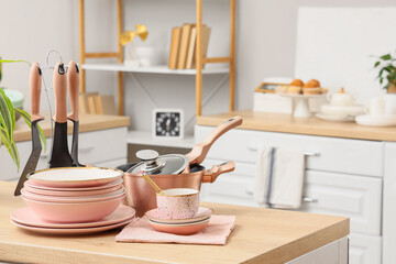 Different clean dishes on counter in kitchen