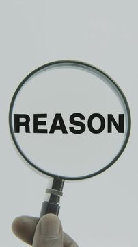 "Reason" text or word highlighted by a magnifying glass held by a hand on a white background, symbolizing focus, analysis, and logical evaluation