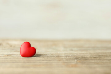 Fototapeta premium Red decorative heart on wooden table, space for text. Happy Valentine's day