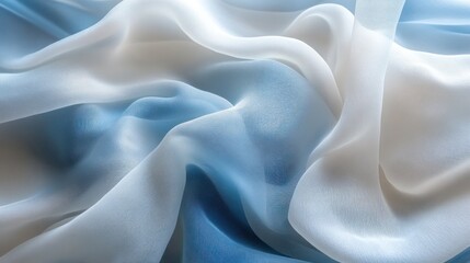 Obraz premium Soft, flowing, pastel blue and white chiffon fabric draped