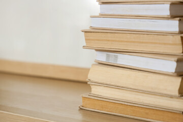 Stack of books on shelf, closeup