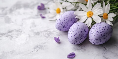 A serene arrangement of purple eggs adorned with delicate white flowers and vibrant purple petals displayed on a rustic table.