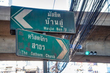 Bangkok, Thailand - December 15, 2019: Directional signs in Bangkok showing routes, highways, and...