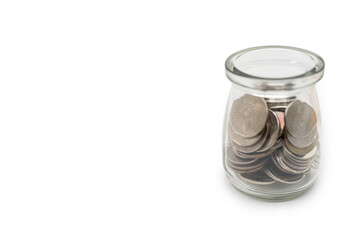 Coins in glass money jar, financial concept. Saving money concept.
