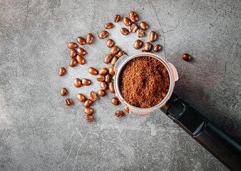 Ground coffee in portafilter filled ready for brewing espresso, Top view