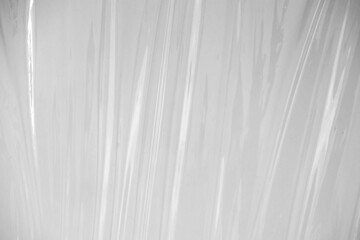 Obraz premium white or translucent plastic sheet with visible creases and folds. the transparent plastic wrap for design overlay