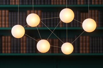 Modern pendant light fixture with spherical bulbs over bookshelves