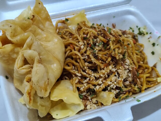 Mie Gacoan, Fried Noodles with a Typical Indonesian Spicy Level, served with Fried Dumplings,...