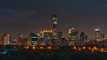 The night scene of the China World Trade Center in Beijing, China, with modern architecture and dazzling lights