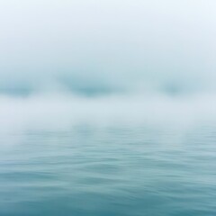 Obraz premium Foggy sky with a body of water in the foreground