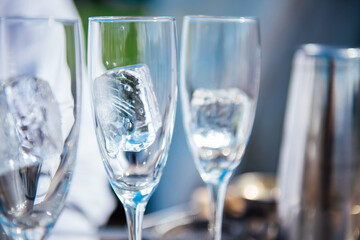 Three empty wine glasses with a large ice cube, preparations for the celebration, wine and...