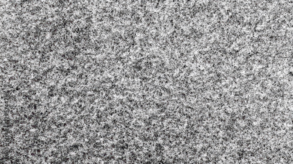 Poster close-up shot of a grainy, textured surface. ideal for backgrounds, adding depth and texture to desi