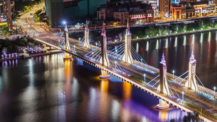 The night view of Shangying Bridge in Tongzhou, Beijing, China lights up the city at night