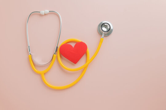 Disease and Care in Pink. Doctors Day appreciation with stethoscope, heart on pink.